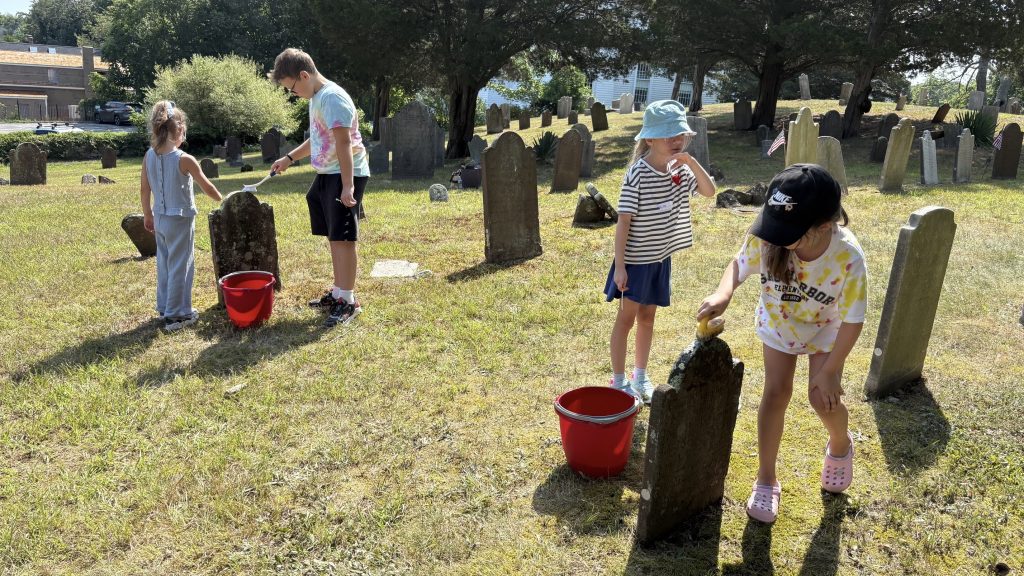 Cleaning headstones at the Old Burying Ground
