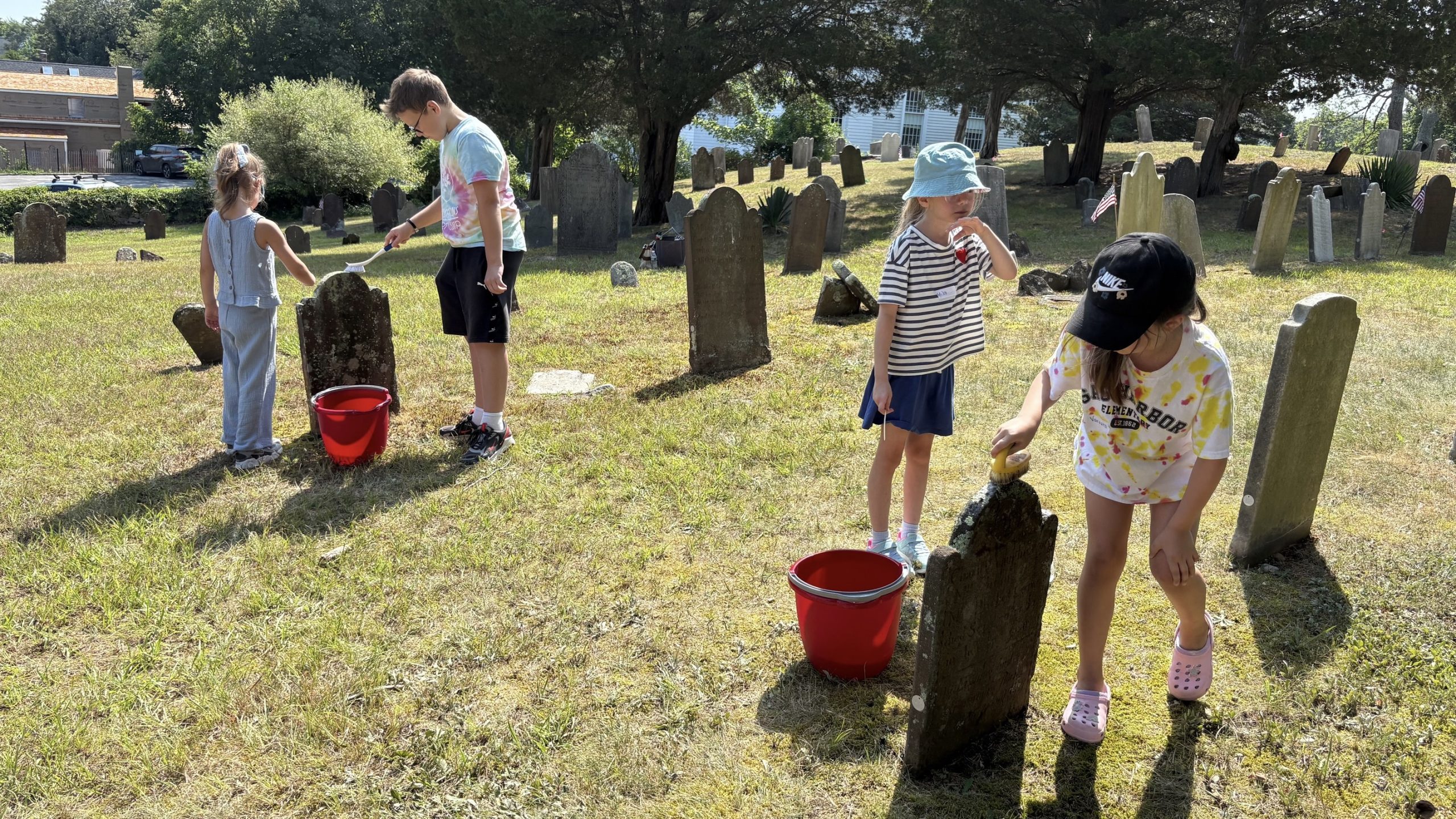 Cleaning headstones at the Old Burying Ground